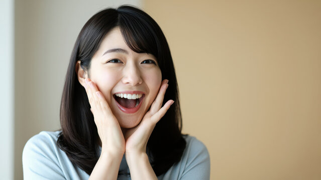 Delighted and Captivated: An individual with an expressive face beams with unbridled joy, their hands tenderly framing their cheeks, reflecting a state of pure euphoria.