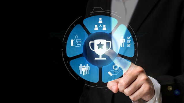 Navigating Digital Achievements: A person interacts with a futuristic digital interface, showcasing a trophy symbol, representing success, and achievement in the digital realm.