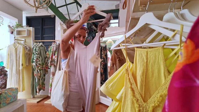 Mature woman shopping for clothes in Teguise market, Lanzarote
