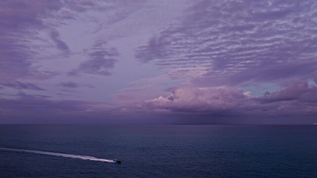 Skyscape at summer vacation. Skyscape with sea sunset. Horizon sunrise sky hyperlapse. Sunrise seascape. Hyperlapse summer seascape. Sea cloudscape horizon hyperlapse. Sunset purple cloudy sky