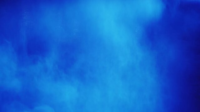 Abstract flowing colored smoke and clouds with dynamic light shifts creating ethereal and atmospheric visual effects for backgrounds and motion graphics.