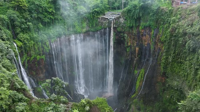 Aerial View of Tumpak Sewu Waterfall and Misty Canyon &ndash; Java Island Indonesia Travel Footage