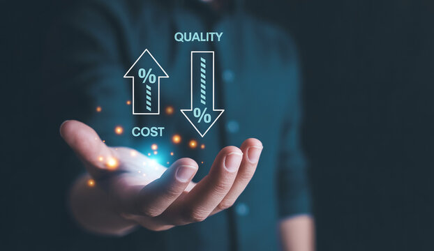Businessman shows graph of increasing quality and decreasing cost over time.