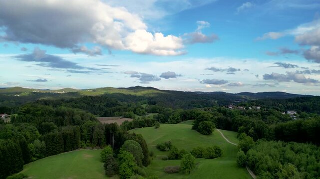 Aerial panorama of the Sonnenwald region near Ranfels and Zenting with forests, hills and cloudy sky
