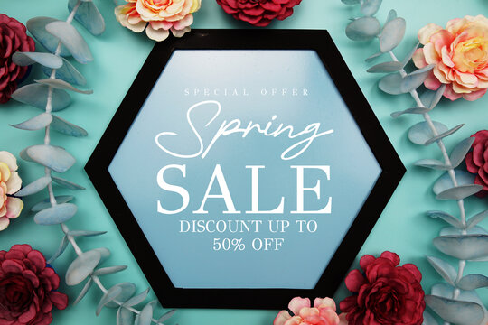 Spring Sale up to 50% Off text on hexagon background with beautiful flowers blooming