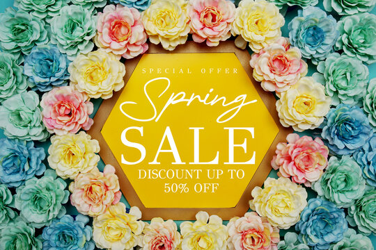 Spring Sale up to 50% Off text on hexagon background with beautiful flowers blooming