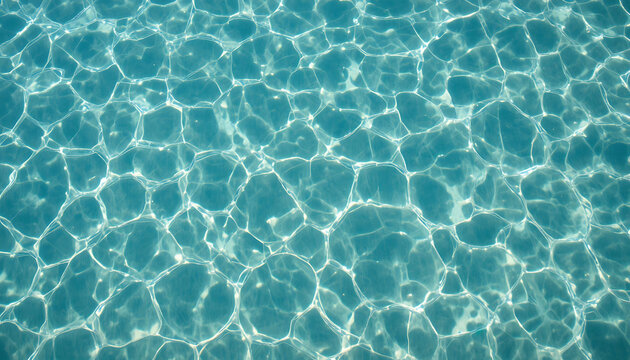Turquoise water with sunlight reflections, ripples, and refracted light patterns blue