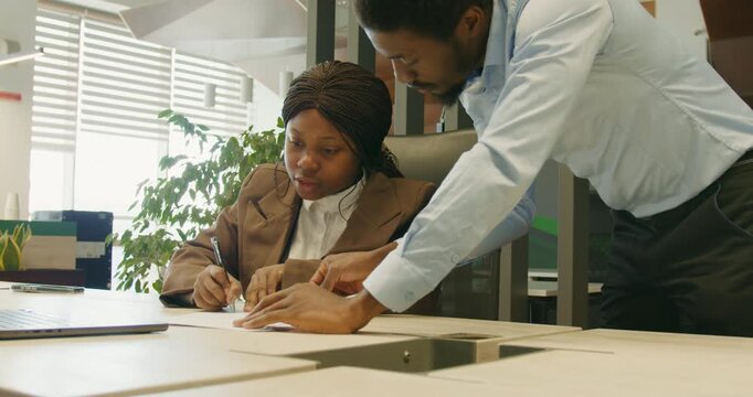 Hr officer verifying onboarding documents with new hire