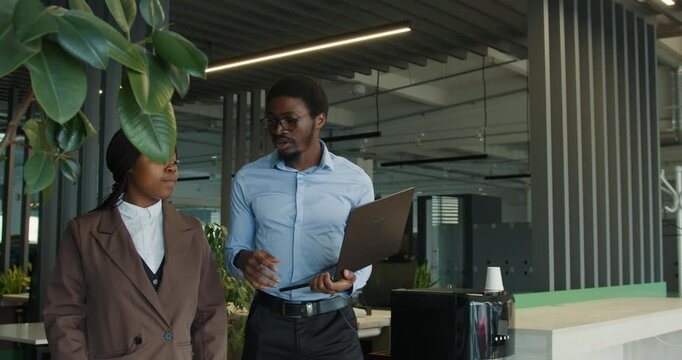 Experts present product details during team meeting in office