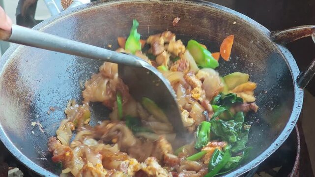 Stir-fried wide rice noodles with soy sauce