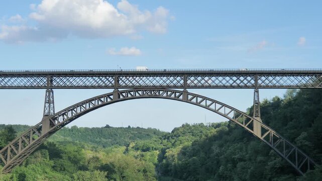 Train on San Michele bridge on Adda river, Lombardy, Italy