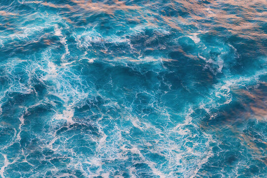 Top View of Turquoise Ocean Water Texture with White Foam and Ripples Sea surface nature background