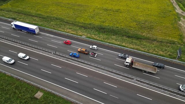 Highway Hustle: A sweeping aerial perspective captures the vibrant flow of vehicles along a multi-lane highway, with each vehicle contributing to the dynamic symphony of the transport network.