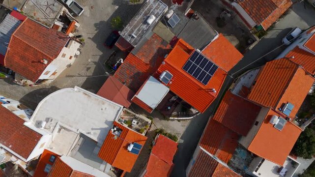 Vertical Aerial Top Down View of Winding Stone Streets and Rooftops in Laneia Village Cyprus