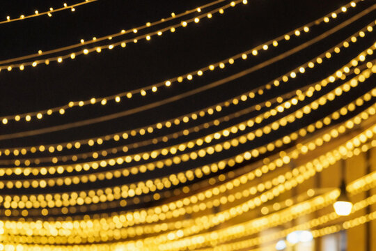 Golden lights twinkle against a dark night sky.