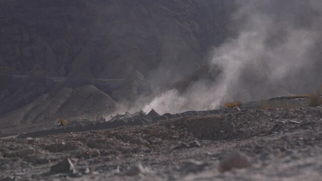 Cinematic Ladakh Mountains Shot with JCB Machines and Trucks on Rocky Construction Site with Smoke