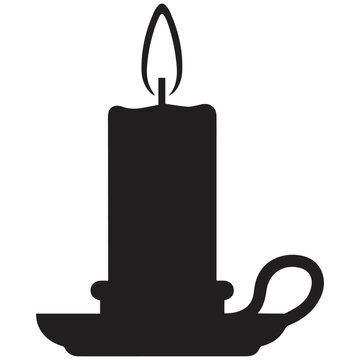 Silhouette of a lit candle in a candlestick with darkness