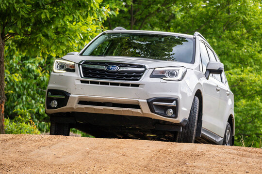 Brno, Czech Republic - May 15, 2025: Subaru Forester driving off-road on an unpaved road in nature. Family SUV on a trip in nature.