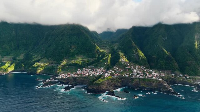 Drone view of Seixal, Madeira island, Portugal, coastal village between Atlantic Ocean and mountain slopes