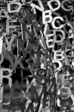 Black and white patterns of metal artwork letters in a pile in Yerevan Armenia