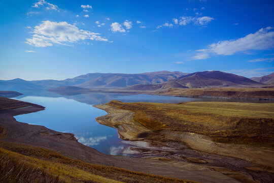 Reflections of Clouds in a Blue Sky Over the Water in the Mountains of Lake Sevan Armenia