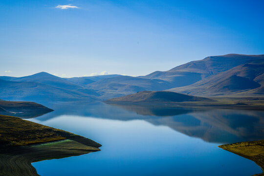 Reflections of Clouds in a Blue Sky Over the Water in the Mountains of Lake Sevan Armenia