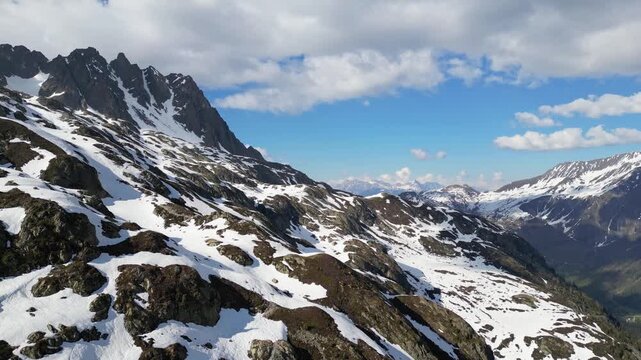 Cinematic drone flight above snowy alpine peaks near Lac Blanc in Chamonix, France, captured in slow motion