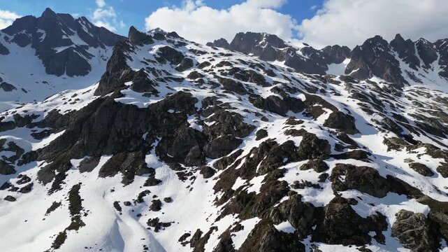 Cinematic drone flight above snowy alpine peaks near Lac Blanc in Chamonix, France, captured in slow motion