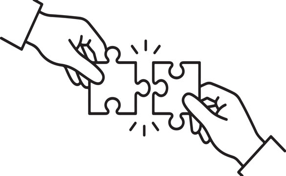 Hands putting together puzzle pieces in a teamwork concept isolated on white background