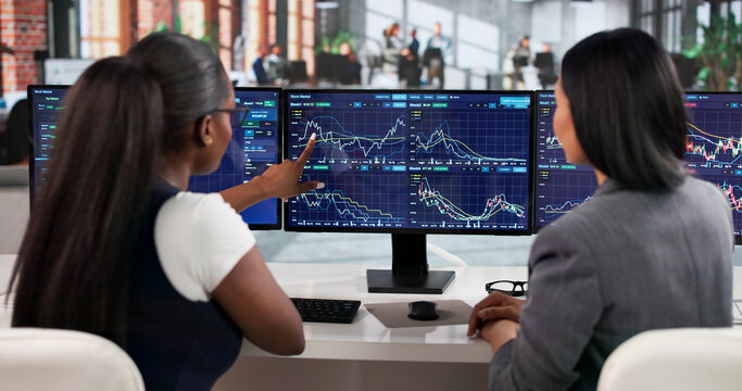 Trader Carefully Studies Market Trends On Computer
