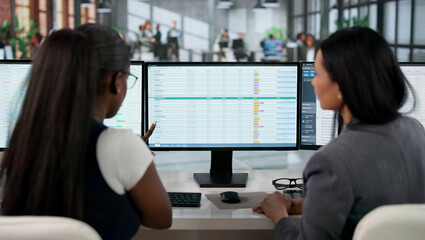 Medical Coder Carefully Typing Billing Codes On Computer