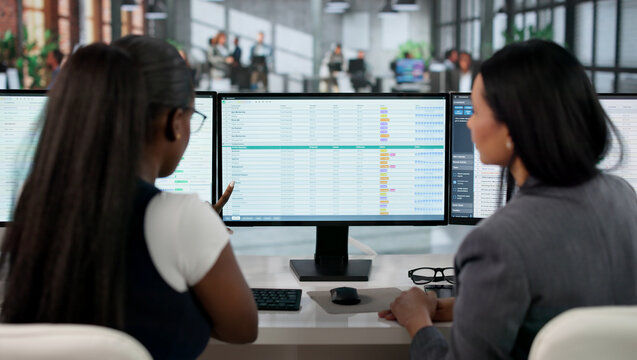 Medical Coder Carefully Typing Billing Codes On Computer