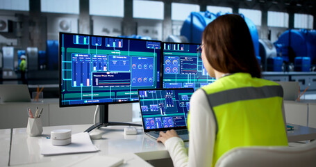 Young Female Engineer Uses SCADA System © Andrey Popov