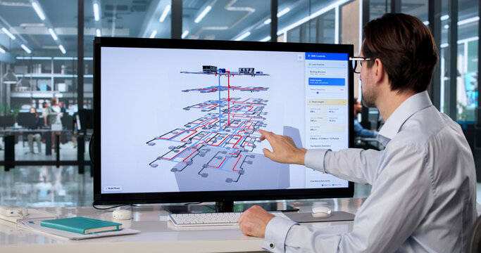 Male Mechanical Engineer Uses Touchscreen Computer