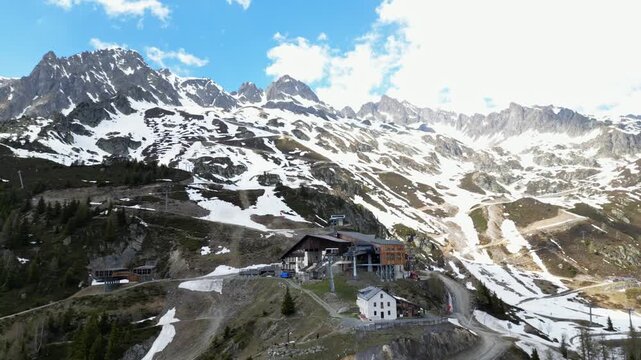 Cinematic drone view of the La Flegere mountain station and alpine refuge above Chamonix, France