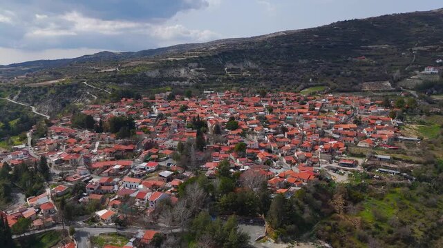 Scenic Aerial Pan Out Showing Koilani Village and Mediterranean Mountain Vista Cyprus
