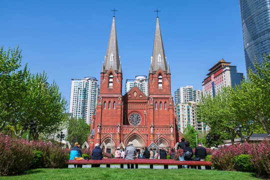 Christian people at garden view St. Ignatius Xujiahui Cathedral, Shianghai
