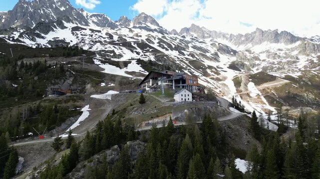 Cinematic drone view of the La Flegere mountain station and alpine refuge above Chamonix, France