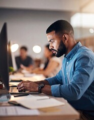 Fototapeta premium Focused Businessman Working Late on Laptop in Modern Office
