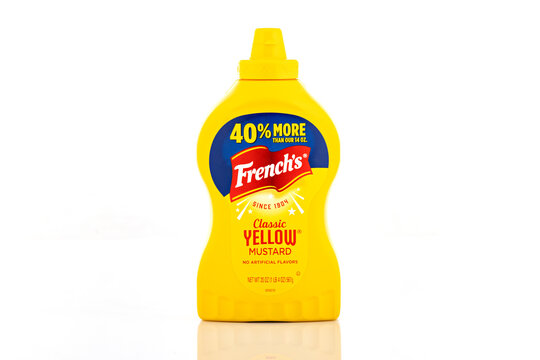 French&rsquo;s Classic Yellow Mustard squeeze bottle isolated on light background. Illustrative editorial studio product photography of popular condiment packaging for food and grocery concepts.