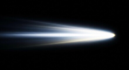 Fototapeta premium A bright light streaking through the dark space with a long glowing trail