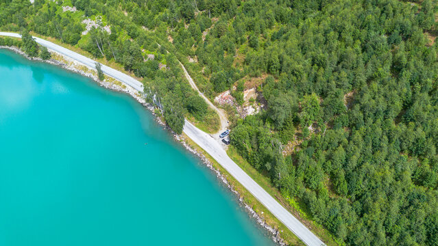 Turquoise Road Curve Along Oldevatnet Lake in Olden Norway