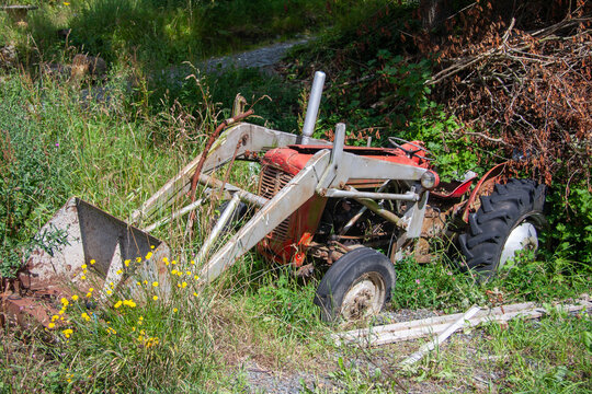 Rusty Vintage Tractor in Rural Landscape