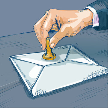 Hand sealing an envelope with a golden wax stamp.