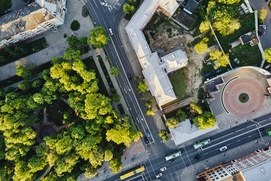 Aerial view of city crossroad with cars