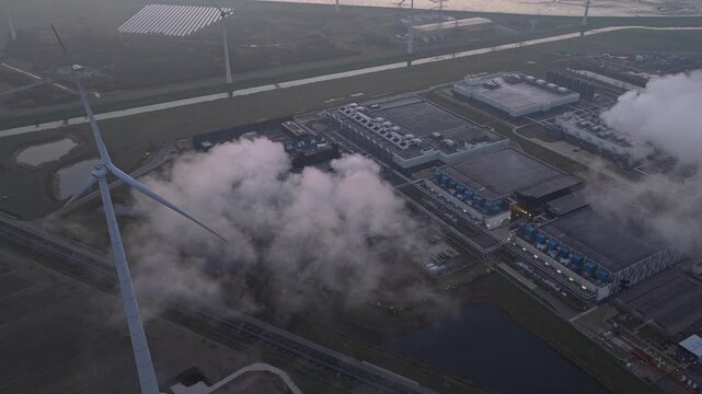 Aerial view of google data center and wind turbines