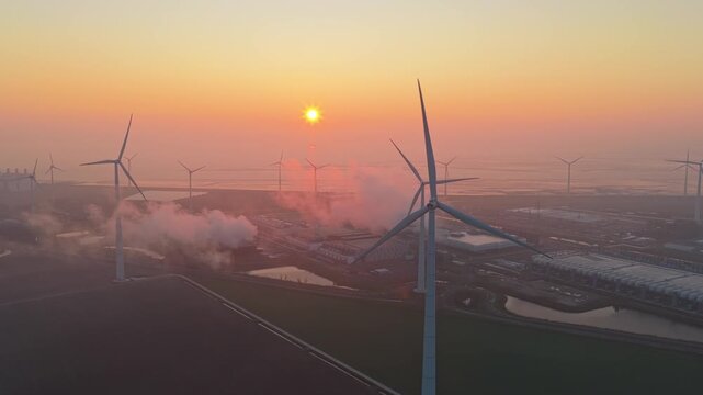Aerial view of wind turbines powering google data center at sunrise