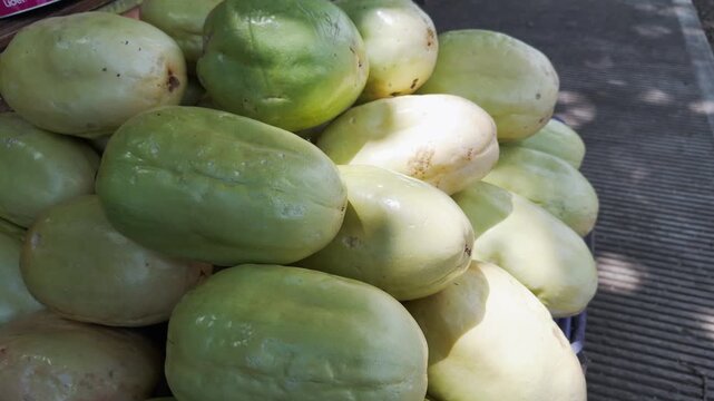 Close-up of pile of fresh sweet granadillas, type of passion fruit, for sale at local market