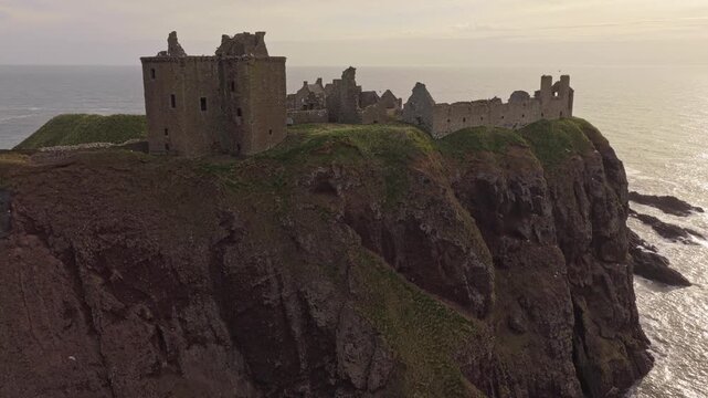 Revealing aerial view of dunnottar castle on scotland's coastline