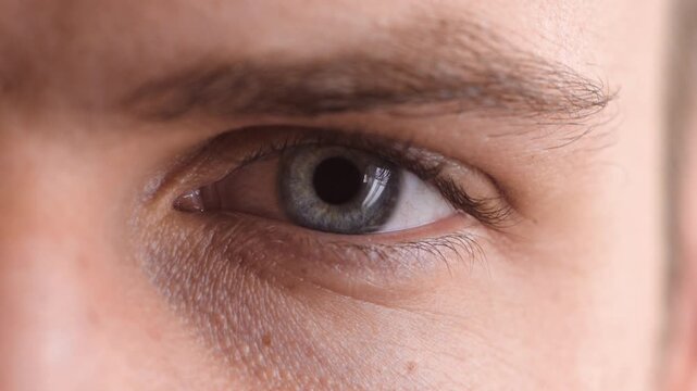 Eye, face and vision health with person for optometry, eyesight wellness and glaucoma test. Closeup, ophthalmology and ocular care with iris, contact lens and portrait with optical assessment